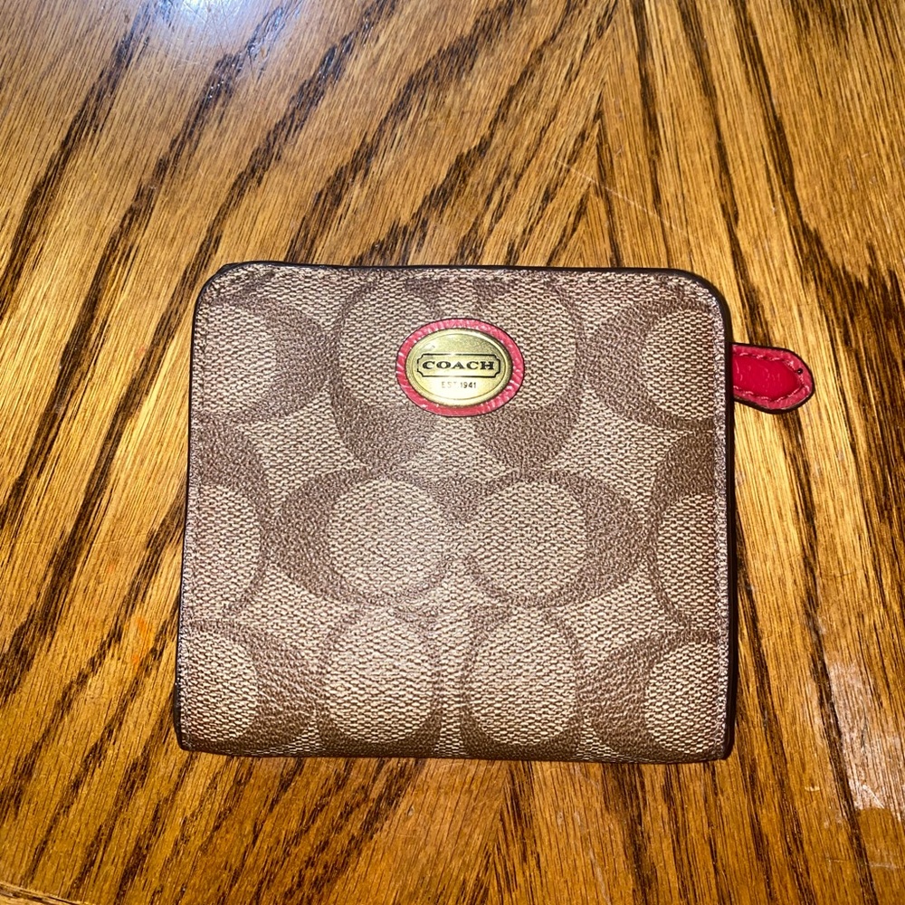 Coach wallet, the bend is slightly worn but shown in pictures